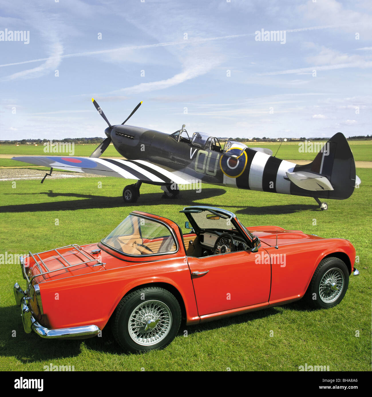 Triumph TR4 with Surrey top. Spitfire Mk9 2 seater in background. Stock Photo