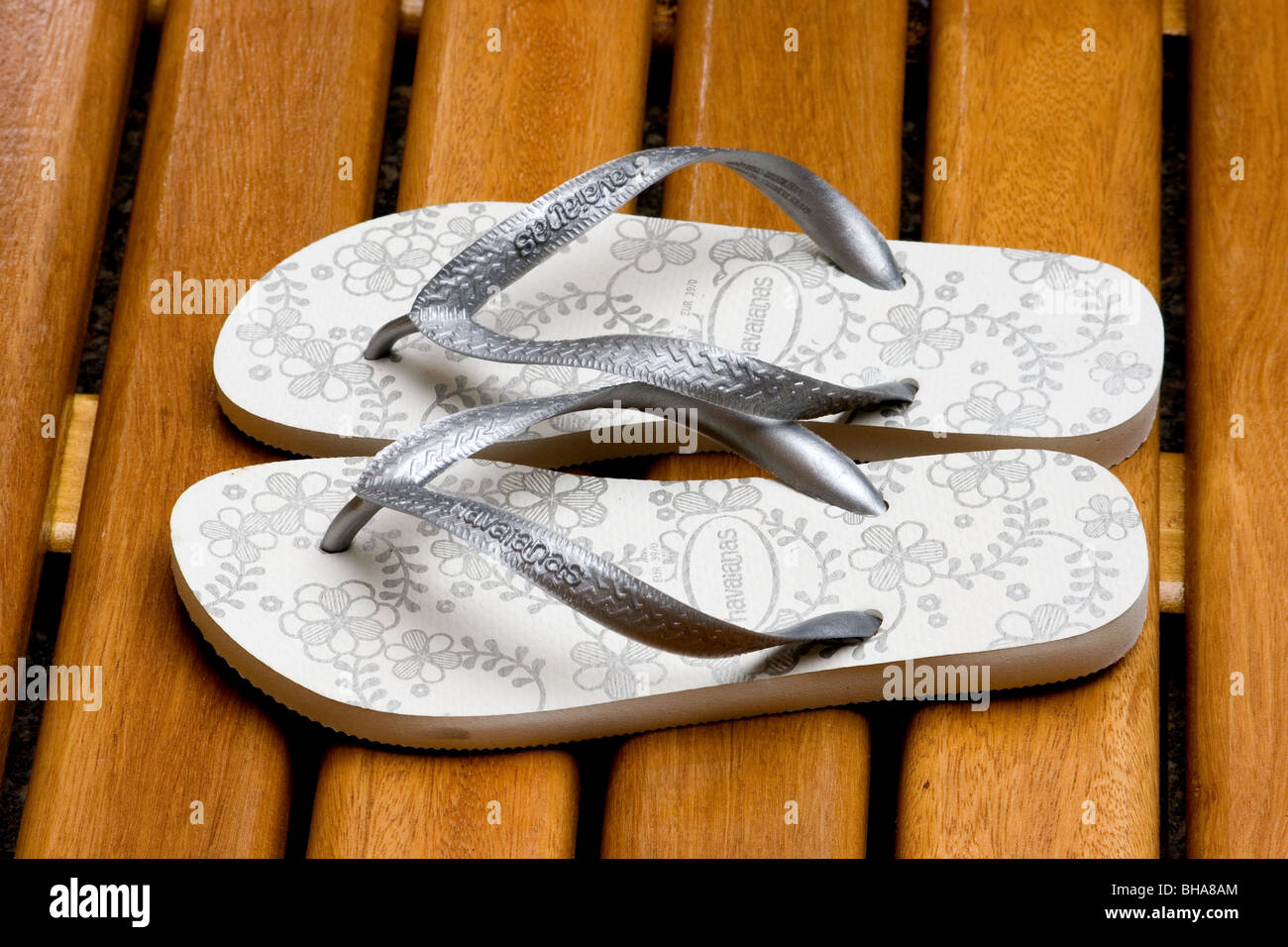 Flip-flops sandals on wooden deck Stock Photo