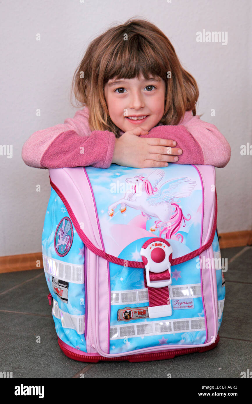 portrait of a small girl with her schoolbag Stock Photo