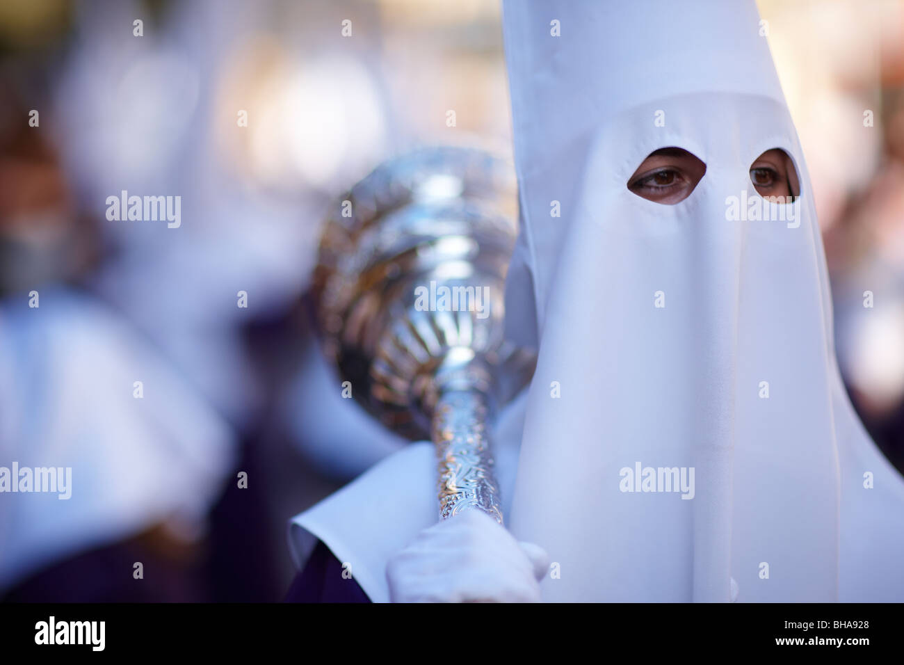 a penitent carrying a mace in the Semana Santa procession in Malaga, Andalucia, Spain Stock Photo