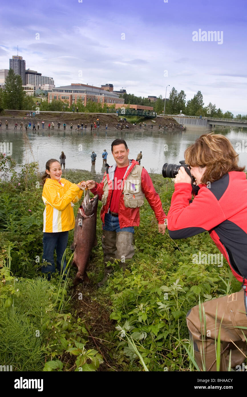 Family Poses for Picture w/Caught King Salmon AK SC/nShip Crk Anchorage Summer Slam'nSalmon Derby Stock Photo