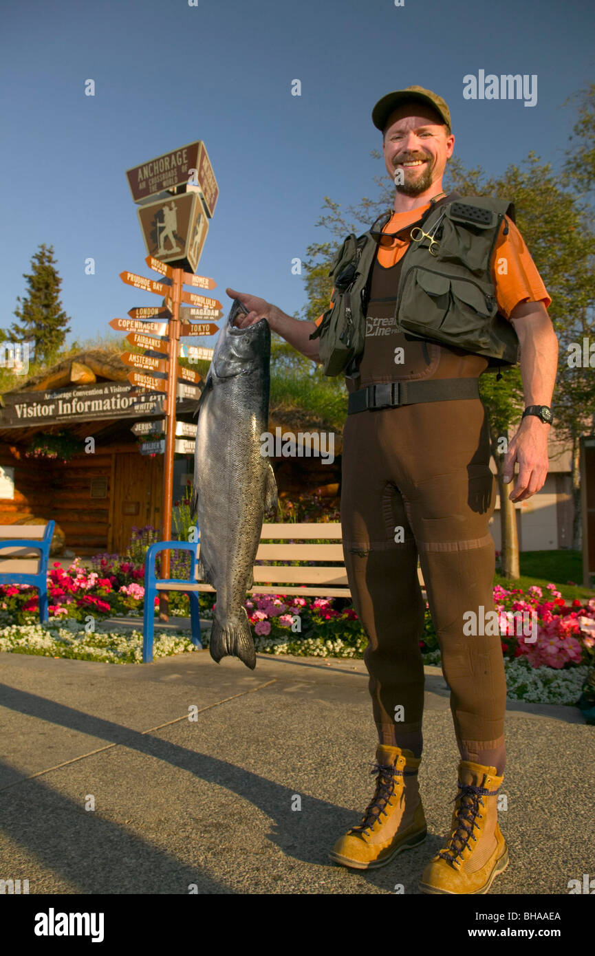 Man in Fishing Gear Holds King Salmon ACVB Digital AK SC Summer