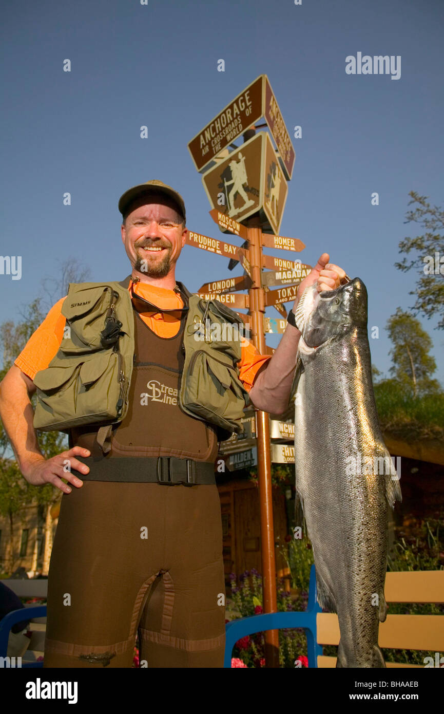 Man in Fishing Gear Holds King Salmon ACVB Digital AK SC Summer