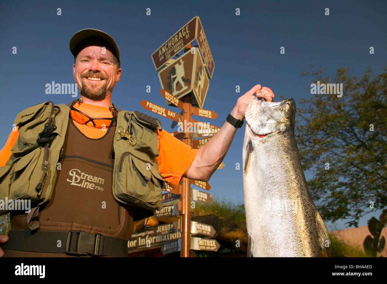 Man in Fishing Gear Holds King Salmon ACVB Digital AK SC Summer