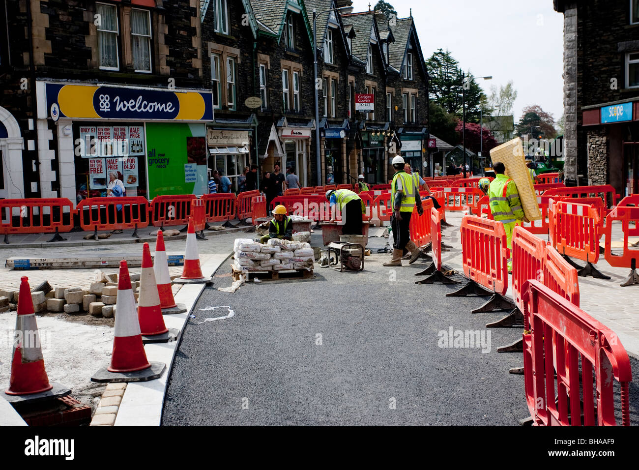 Road works - No trip barrier - temporary site fencing and pedestrian barriers Windermere Town Centre Enhancement Cumbria Stock Photo