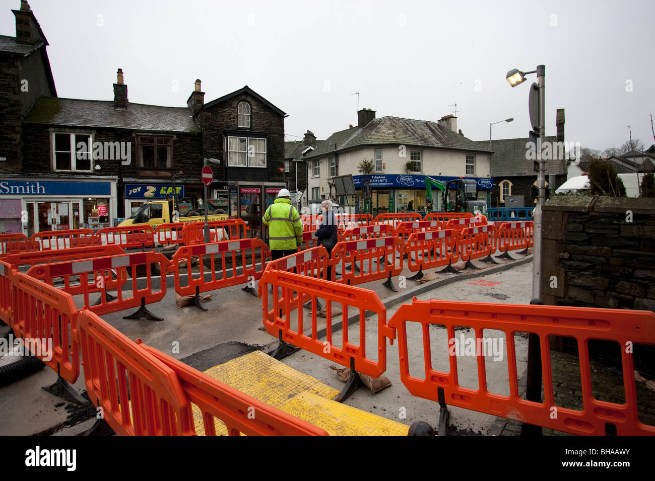 Road works - No trip barrier - temporary site fencing and pedestrian barriers Windermere Town Centre Enhancement Cumbria Stock Photo