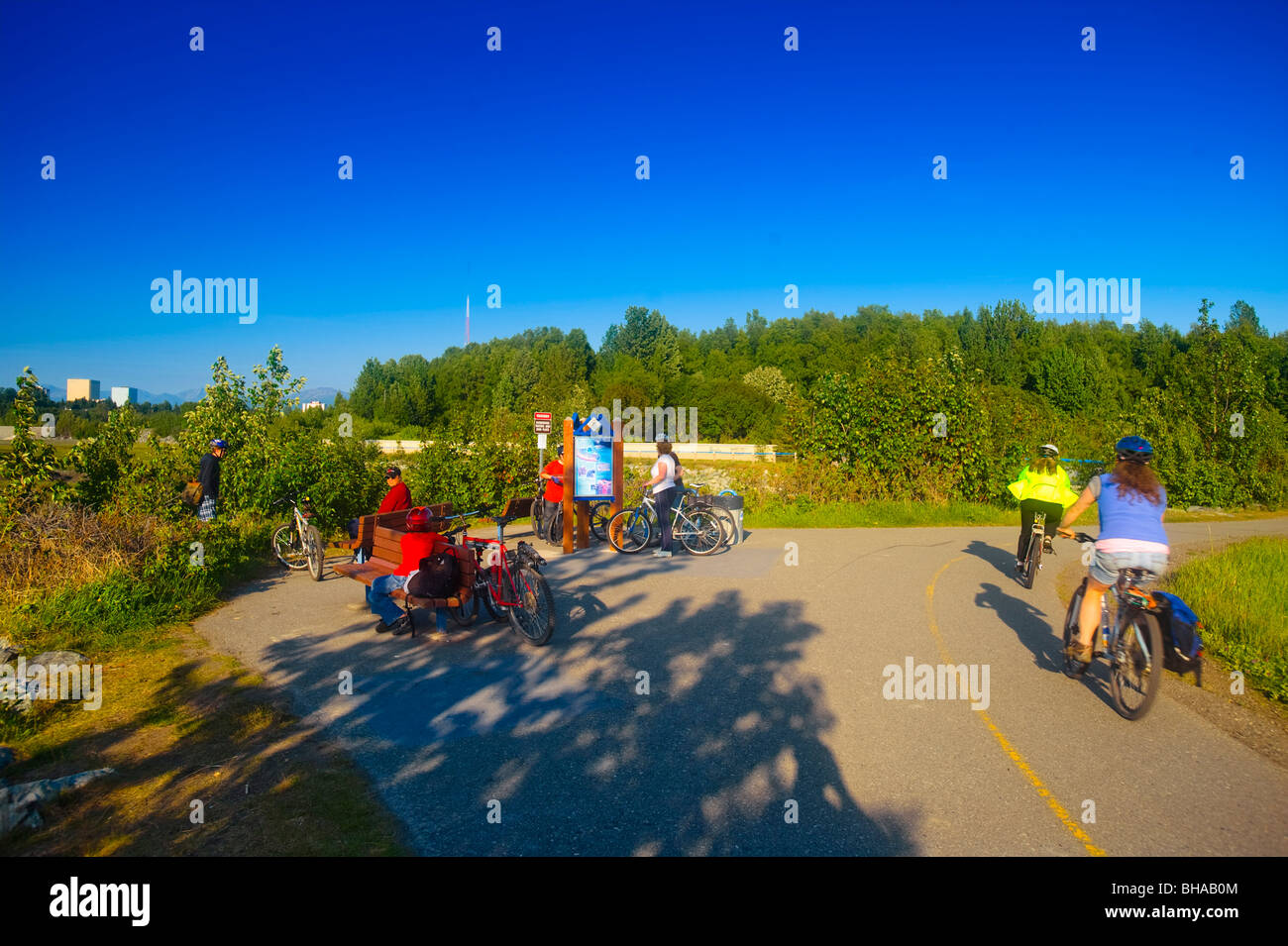 Bicyclists riding on the Tony Knowles Coastal Trail, Anchorage, Southcentral Alaska, Summer Stock Photo