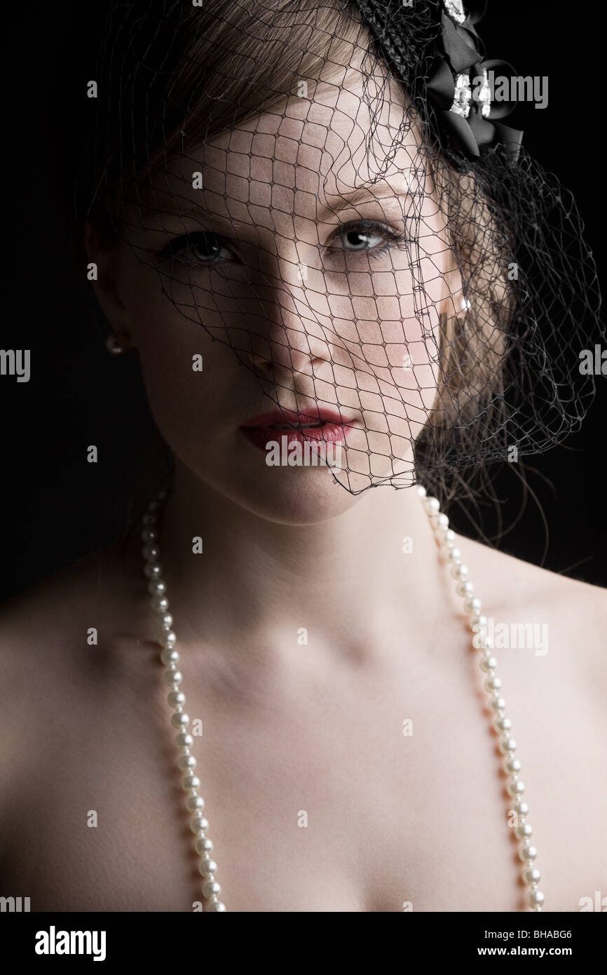 Beautiful Shot of a Pretty Model in Veil and Pearls Stock Photo