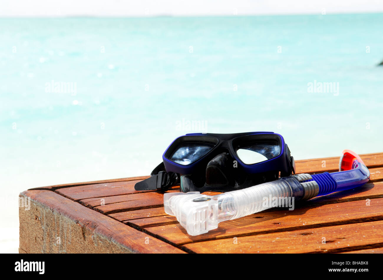 Diving mask and snorkel with sea as background Stock Photo - Alamy