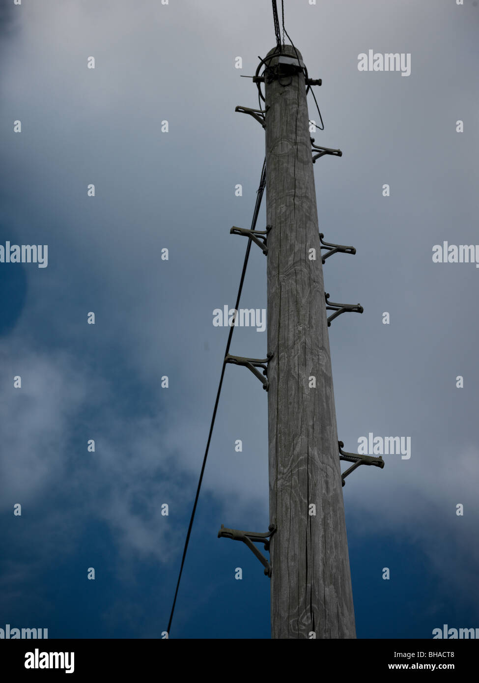 wooden telegraph pole with phone lines Stock Photo