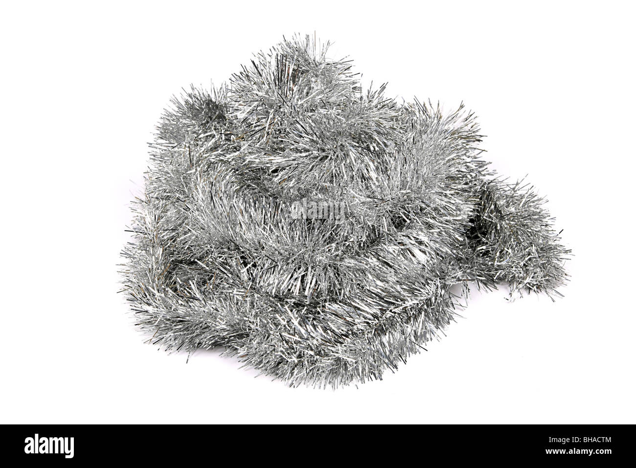 Silver Tinsel against a white background Stock Photo