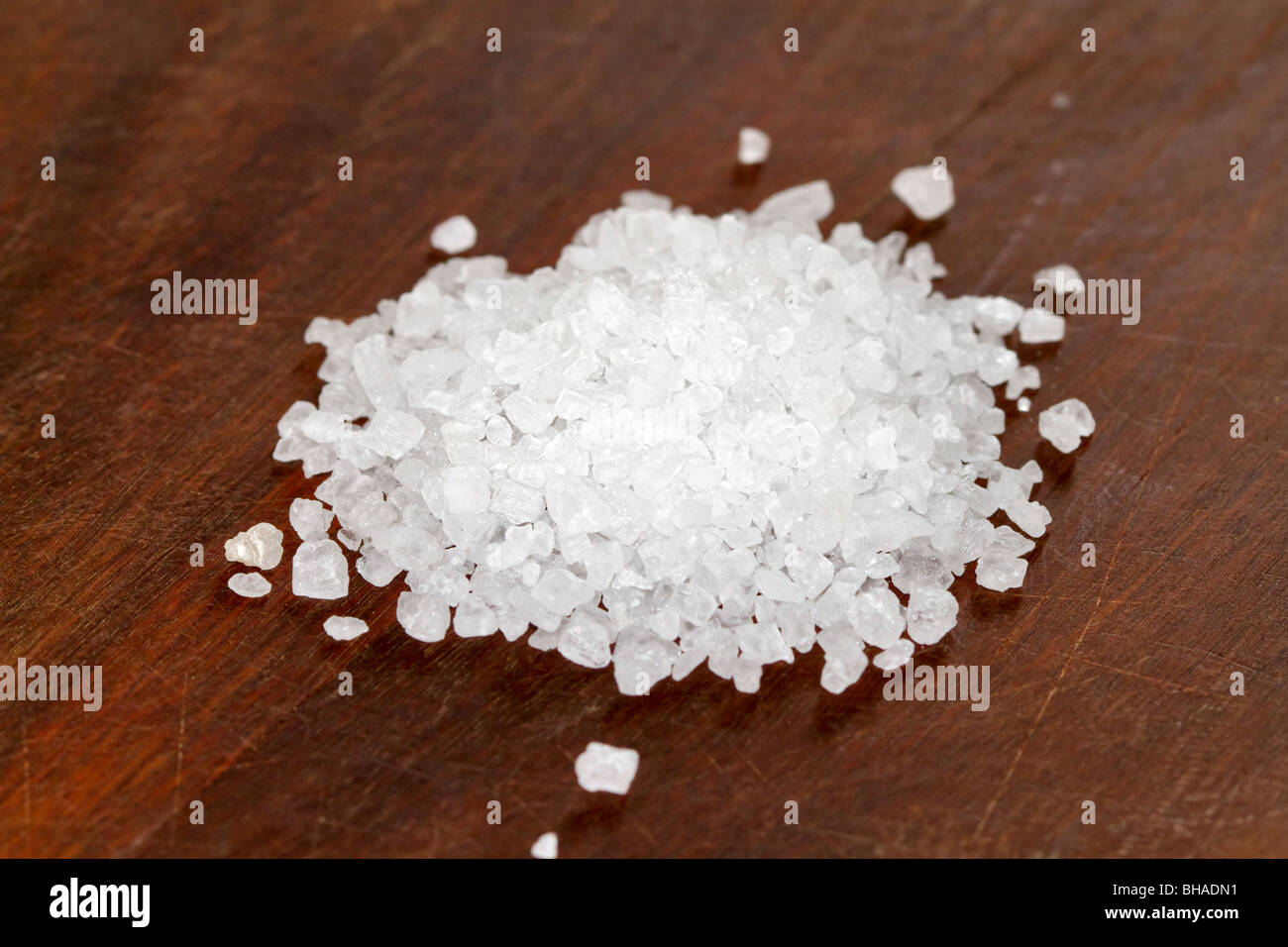 Rock salt on a kitchen chopping block Stock Photo