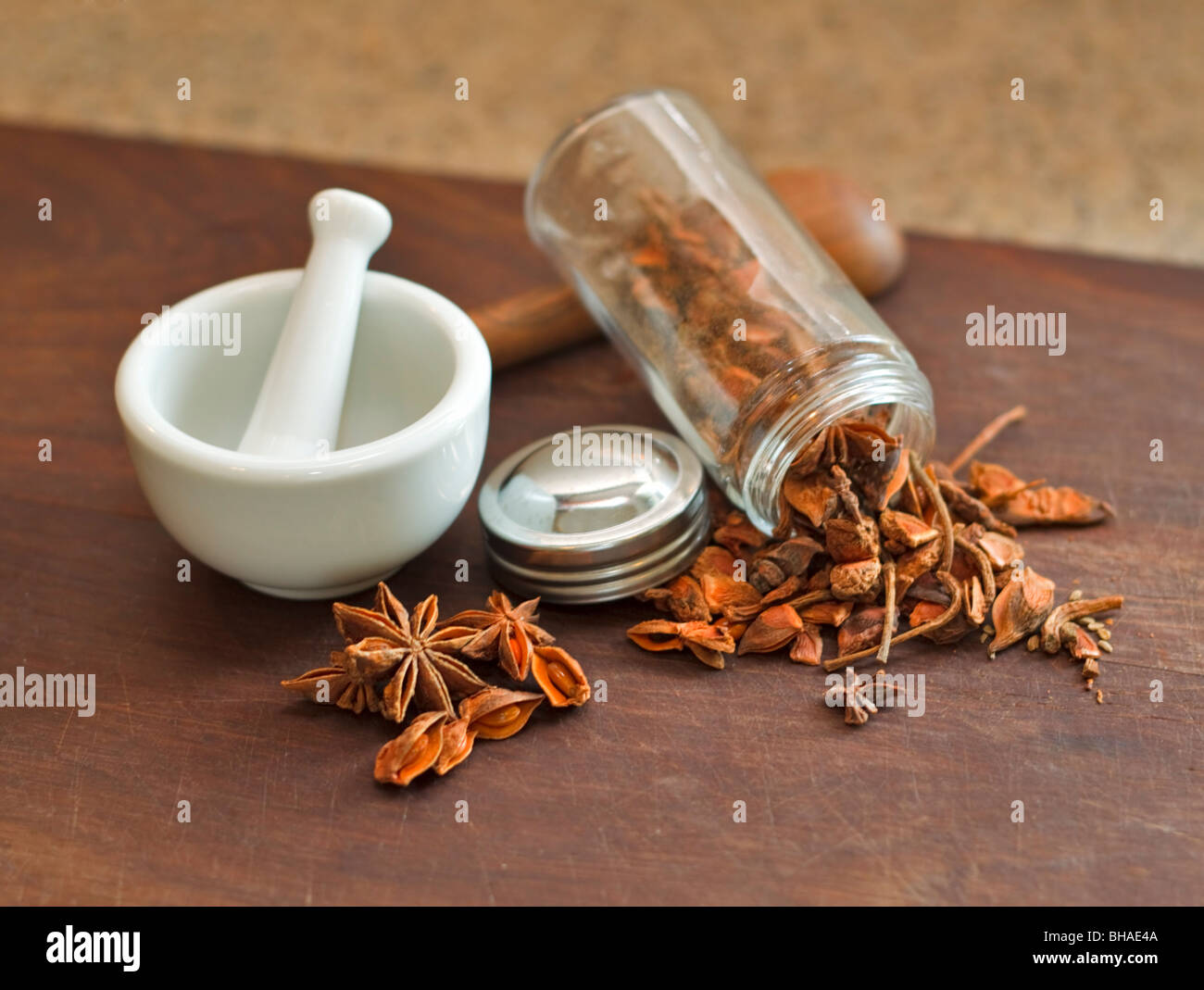 Star anise ready for grinding in a mortal and pestle Stock Photo