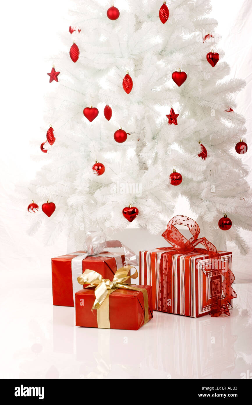 White Christmas Tree with Gifts isolated on white Stock Photo - Alamy