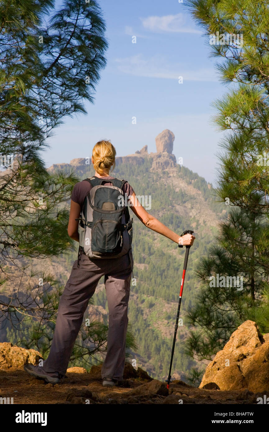 Hiker in Gran Canaria with Roque Nublo in the Background Stock Photo