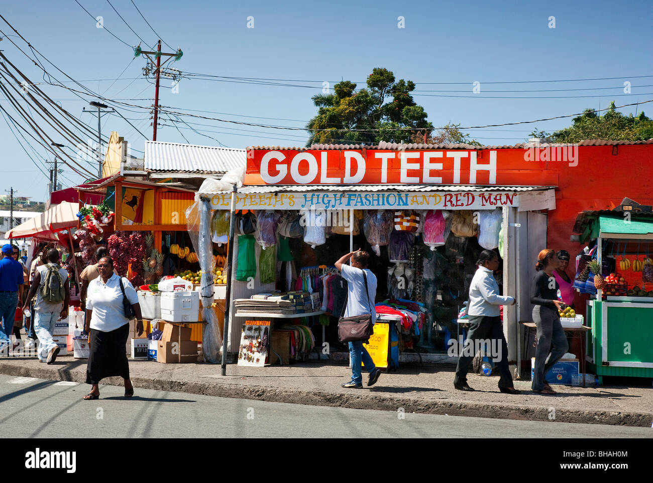 Scarborough market day Tobago fashion stall Gold Teeth and Red Man Stock Photo