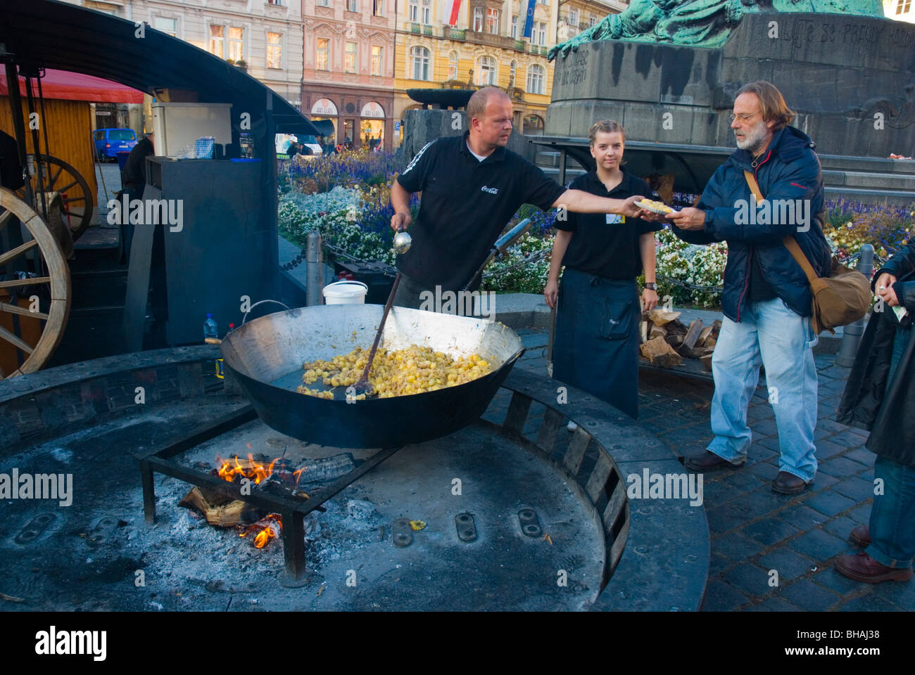 Food cooked in a giant wok pan at old town square in Prague Czech Republic Europe Stock Photo