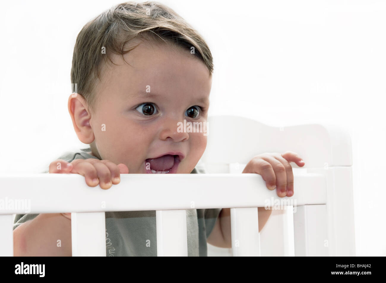 Baby boy in crib Stock Photo Alamy