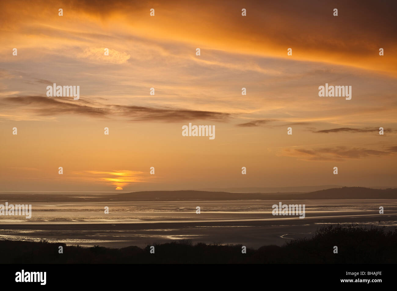 Sunset view across Morecambe Bay from Eaves Wood, Silverdale, Lancashire, England Stock Photo