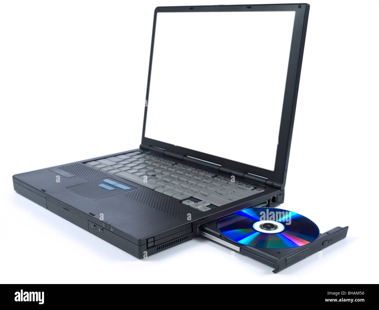 A black laptop with dvd in tray. Isolated over white background. White copy space on screen. Stock Photo