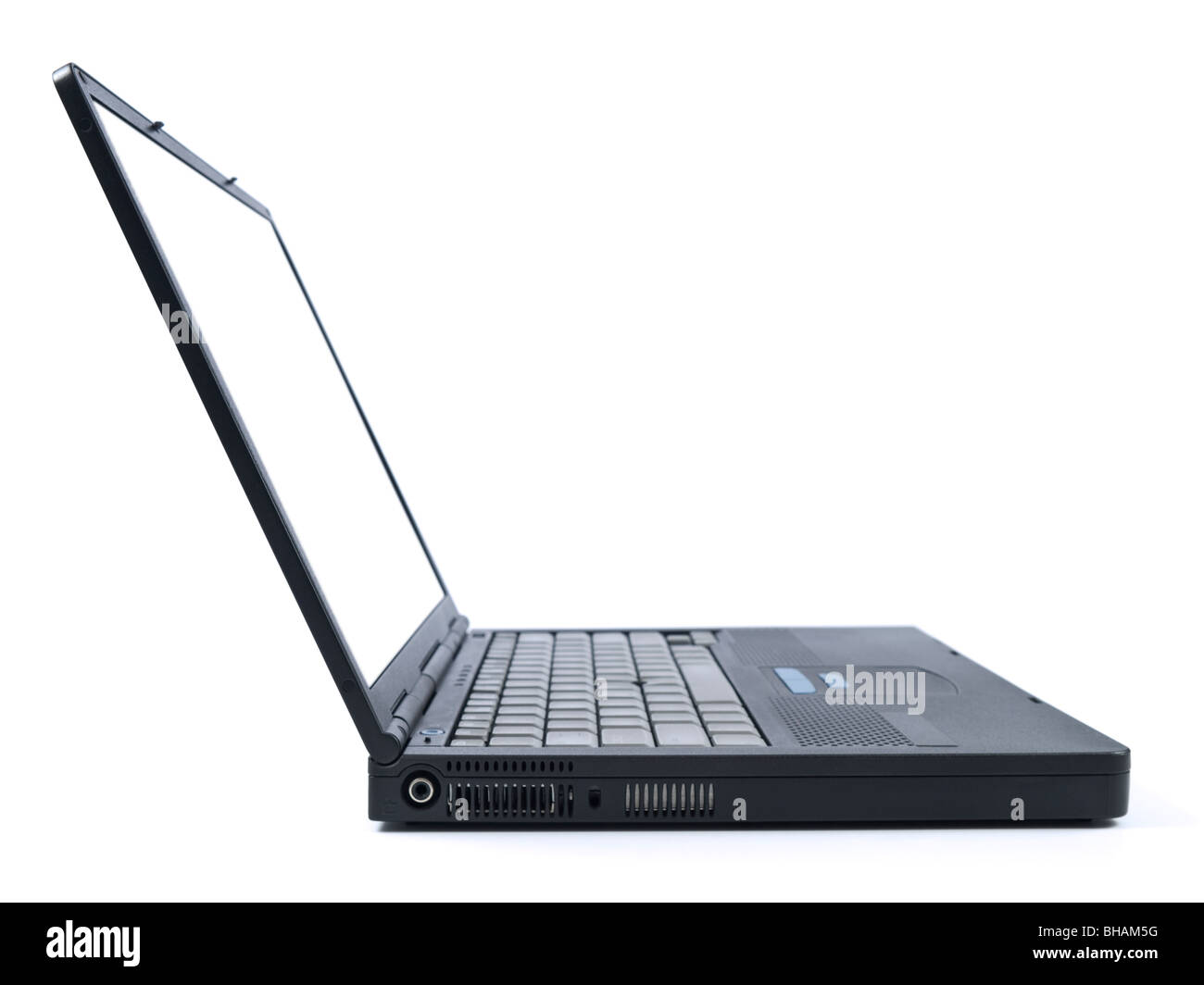 Side view of a black laptop computer isolated on white. Stock Photo