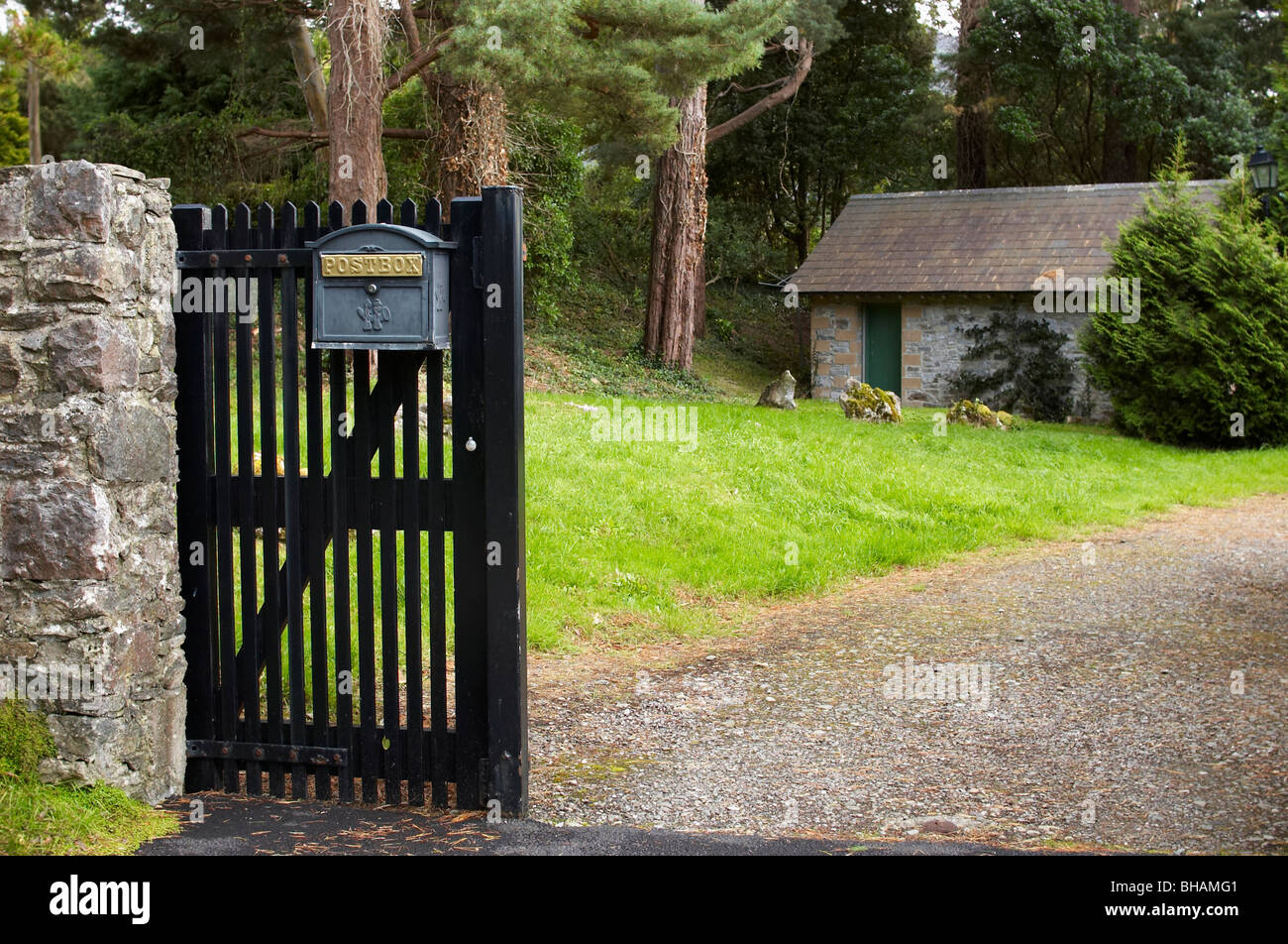 A postbox on a gate Stock Photo - Alamy