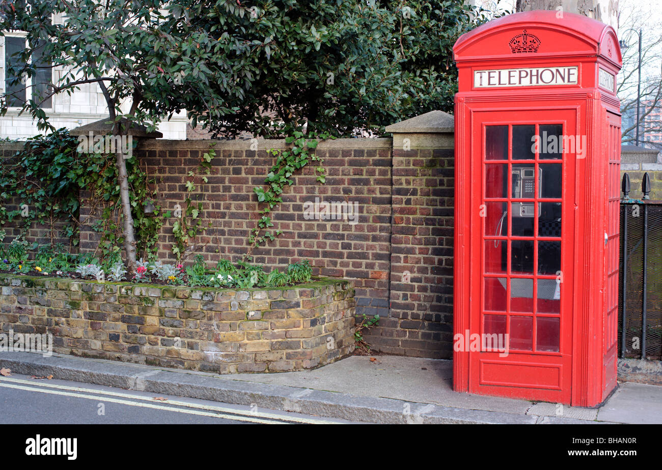 Iconic red telephone box on the Embankment  Westminster London England UK Stock Photo