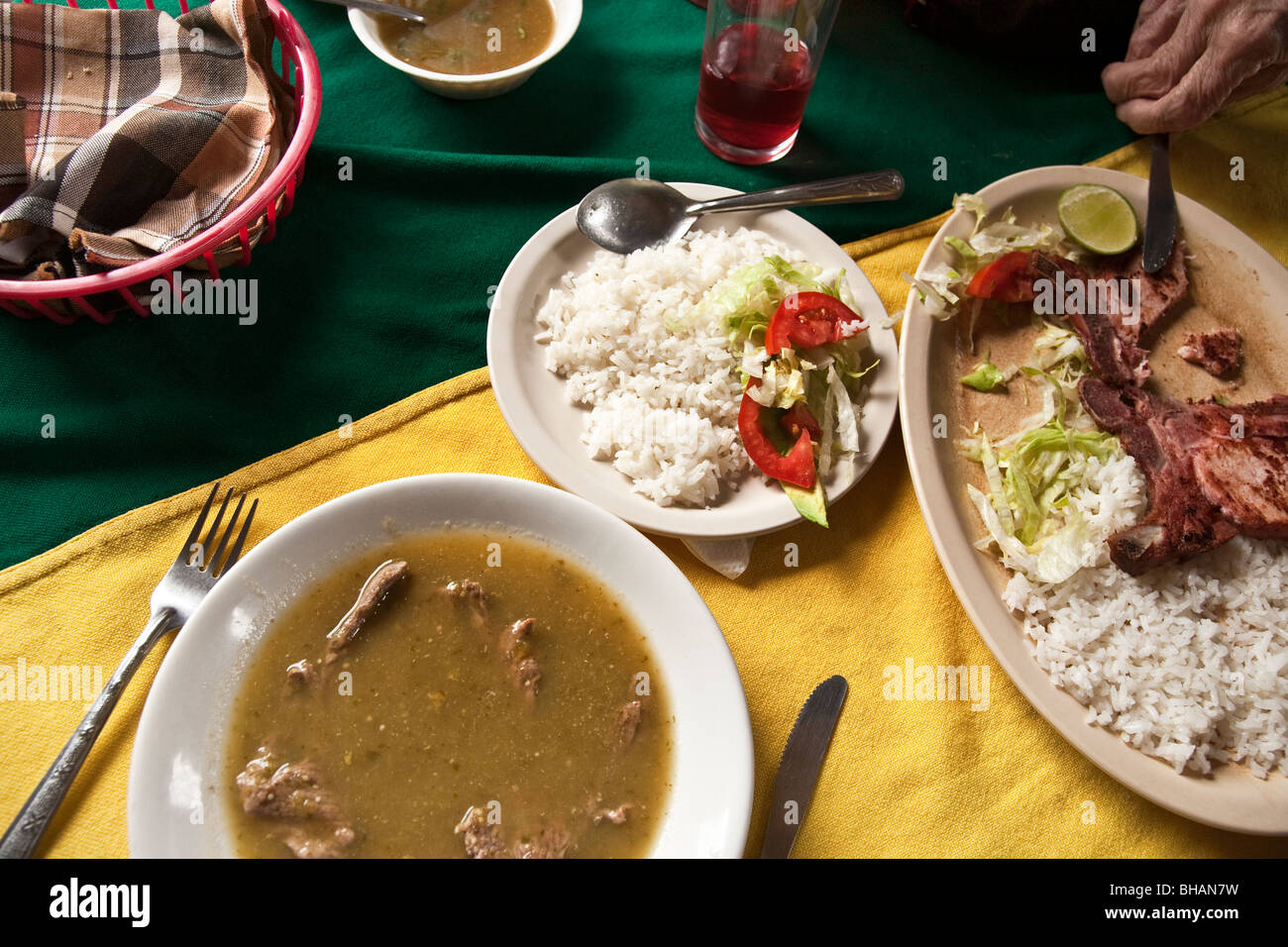 cheap Mexican meal underway for 2 with fried smoked pork chop, beef in