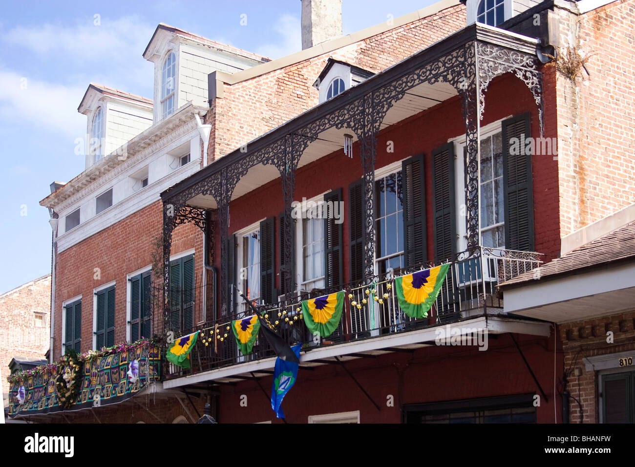 French Quarter balconies with Mardi Gras decorations. Stock Photo
