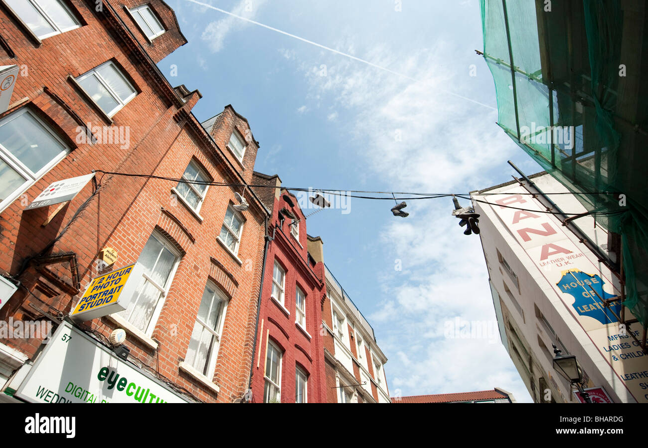 Pairs of shoes hanging from a telephone wire in Spitalfields, London