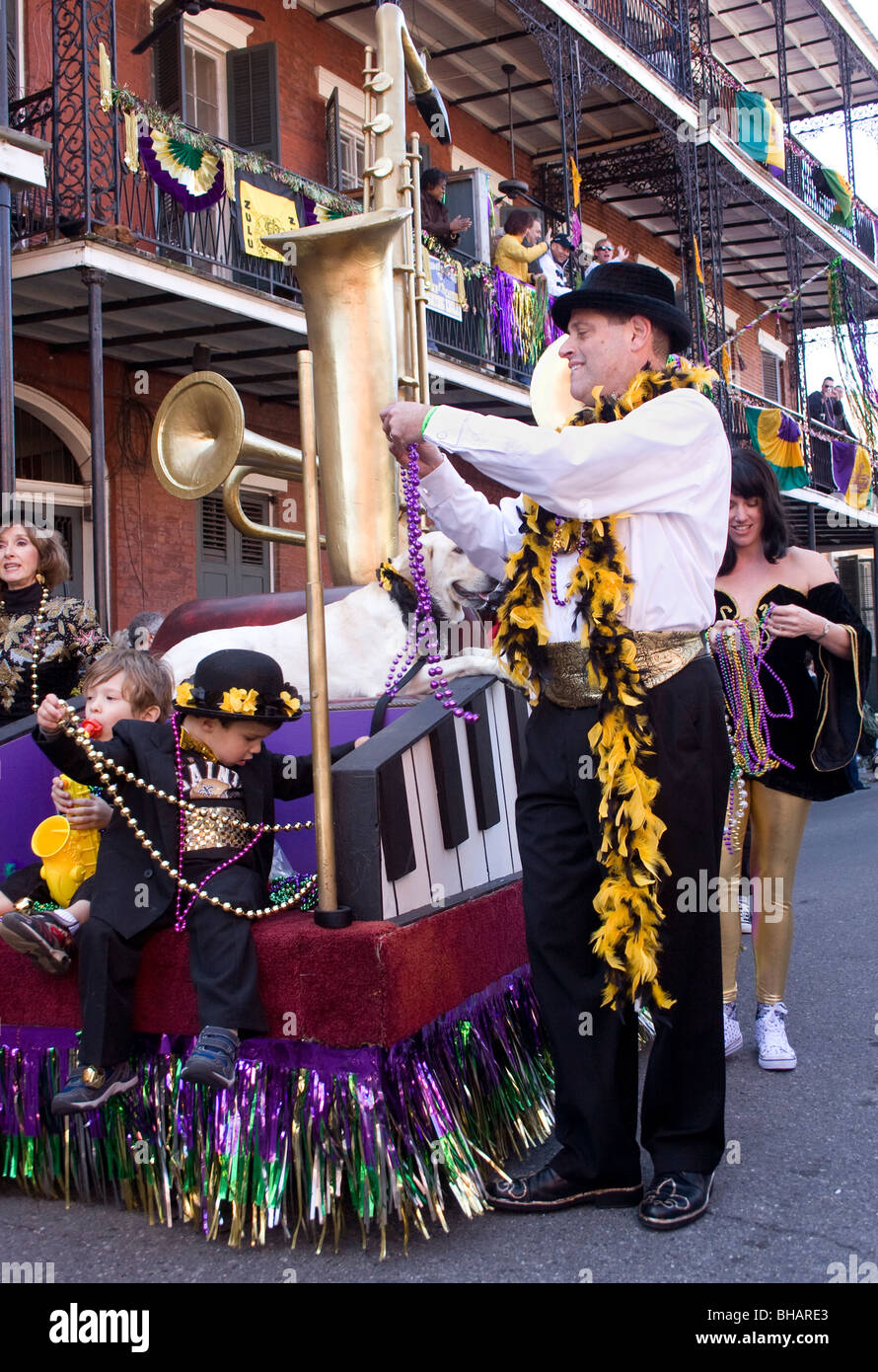 Throwing beads from a float in the Barkus dog parade. New Orleans, LA, USA. Stock Photo