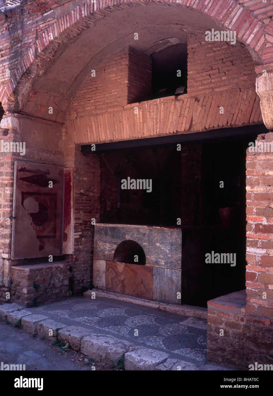 Ostia Antica the ancient port of Rome - the ancient snack bar booth on the Decumanus Maximus main street Stock Photo