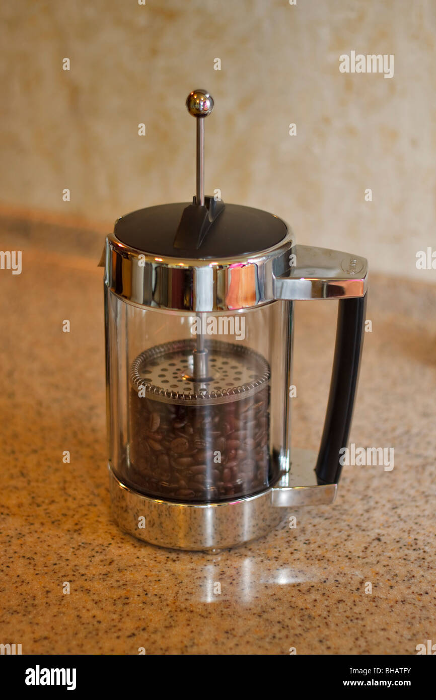 Coffee beans in a French press Stock Photo Alamy