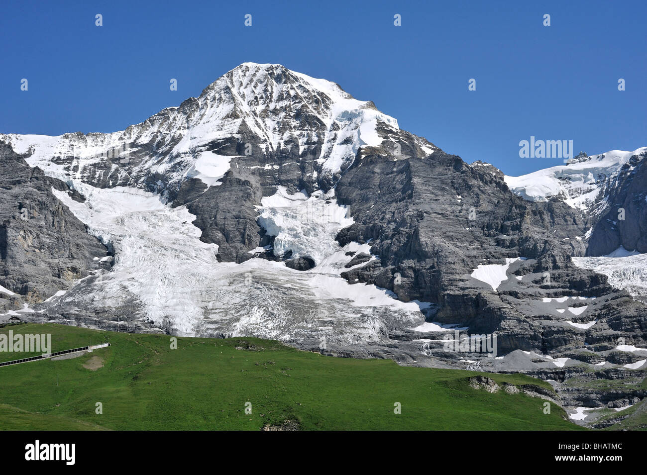 The Mönch forms part of a mountain ridge between the Jungfrau and the Eiger in the Bernese Alps, Switzerland Stock Photo