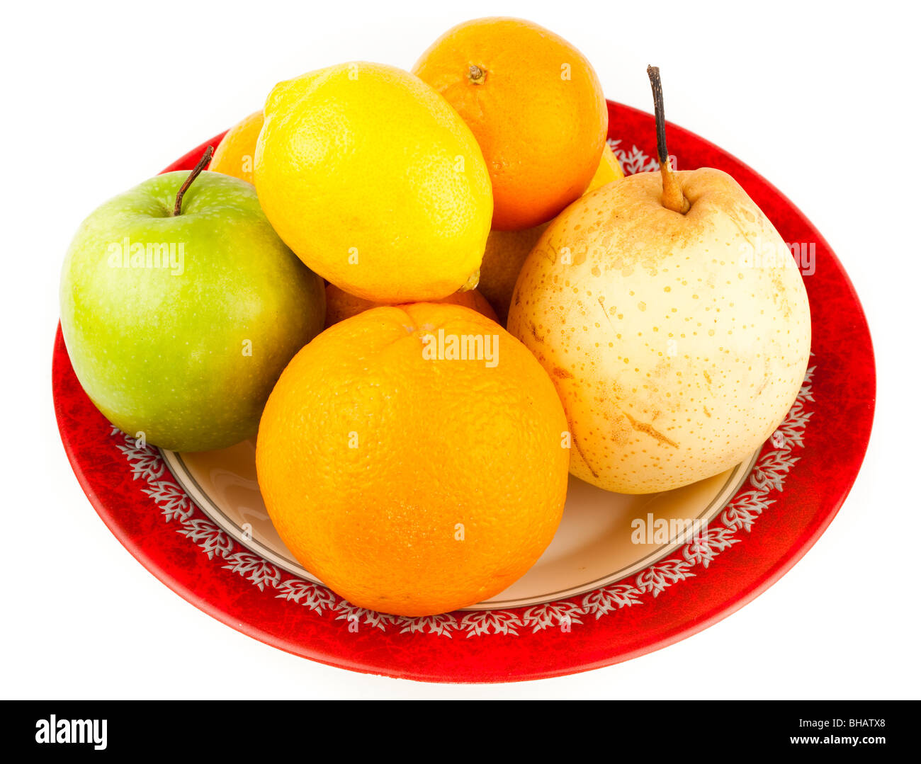 Ripe Fruit in a plate on a white background. Stock Photo
