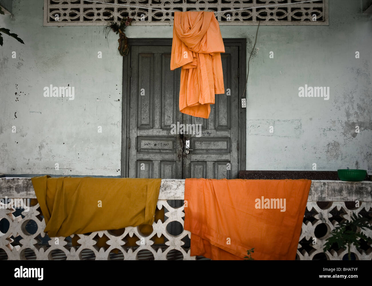 Buddhist Monks robes dry on balcony at pagoda / temple in Kralanh, Siem Reap Province, Cambodia Stock Photo