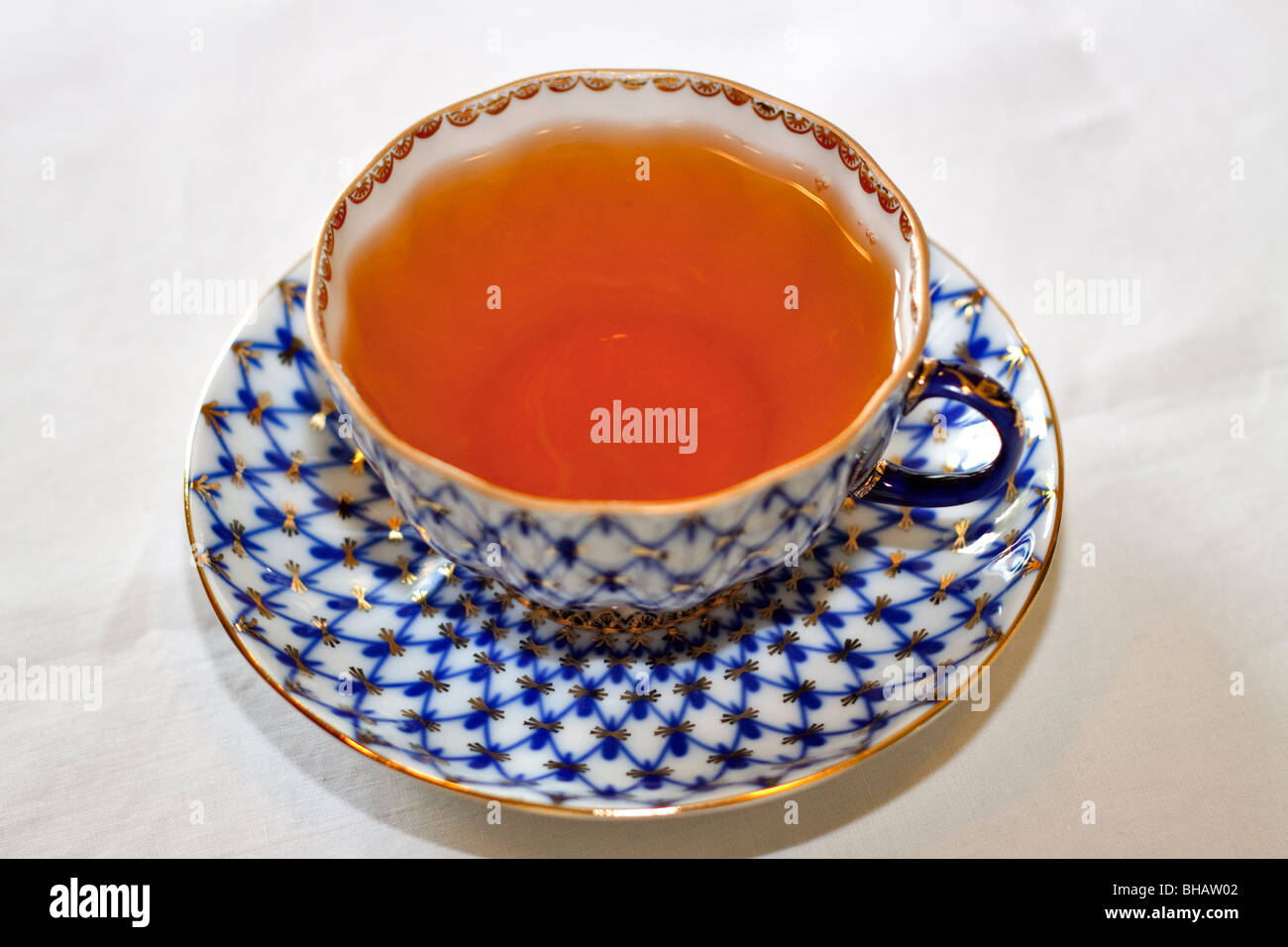 A cup of tea in a fine porcelain cup and saucer Stock Photo
