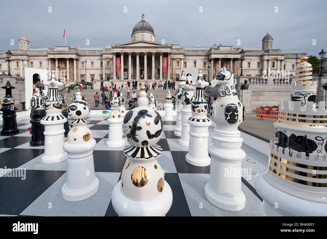 Giant ceramic chess pieces on a glass mosaic chess board  by Spanish designer Jaime Hayon in Trafalgar Square, London Stock Photo