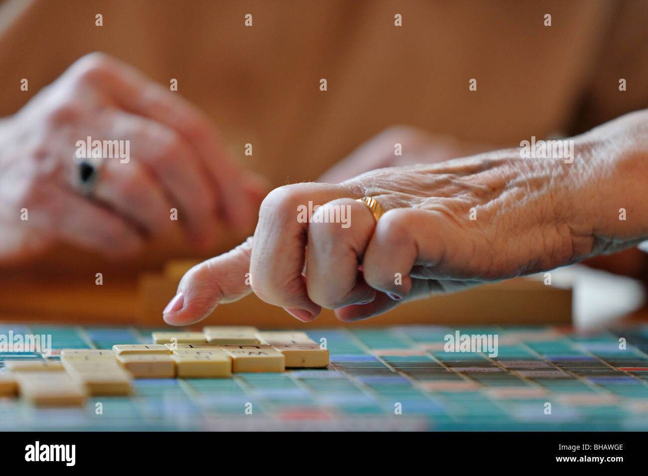 Playing scrabble in a old peoples home Stock Photo