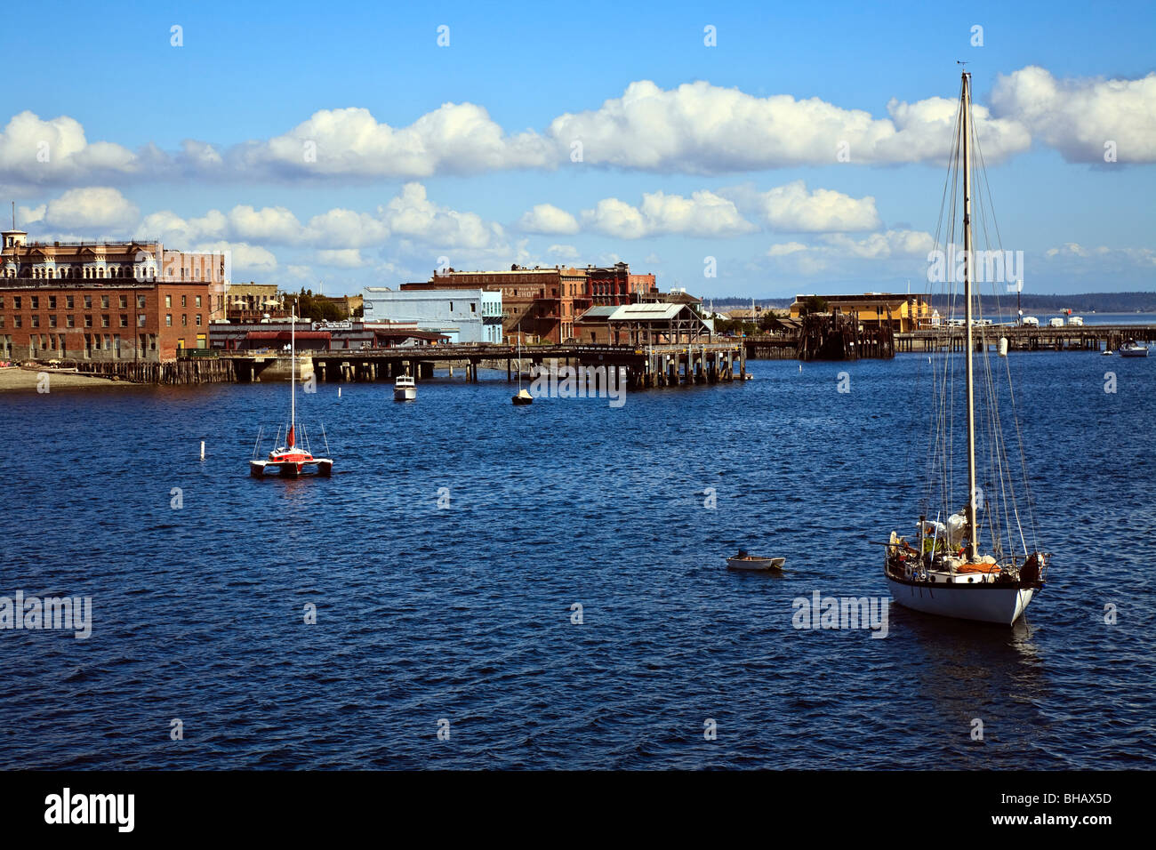 Port Townsend waterfront from Puget Sound with boats anchored in foreground Stock Photo