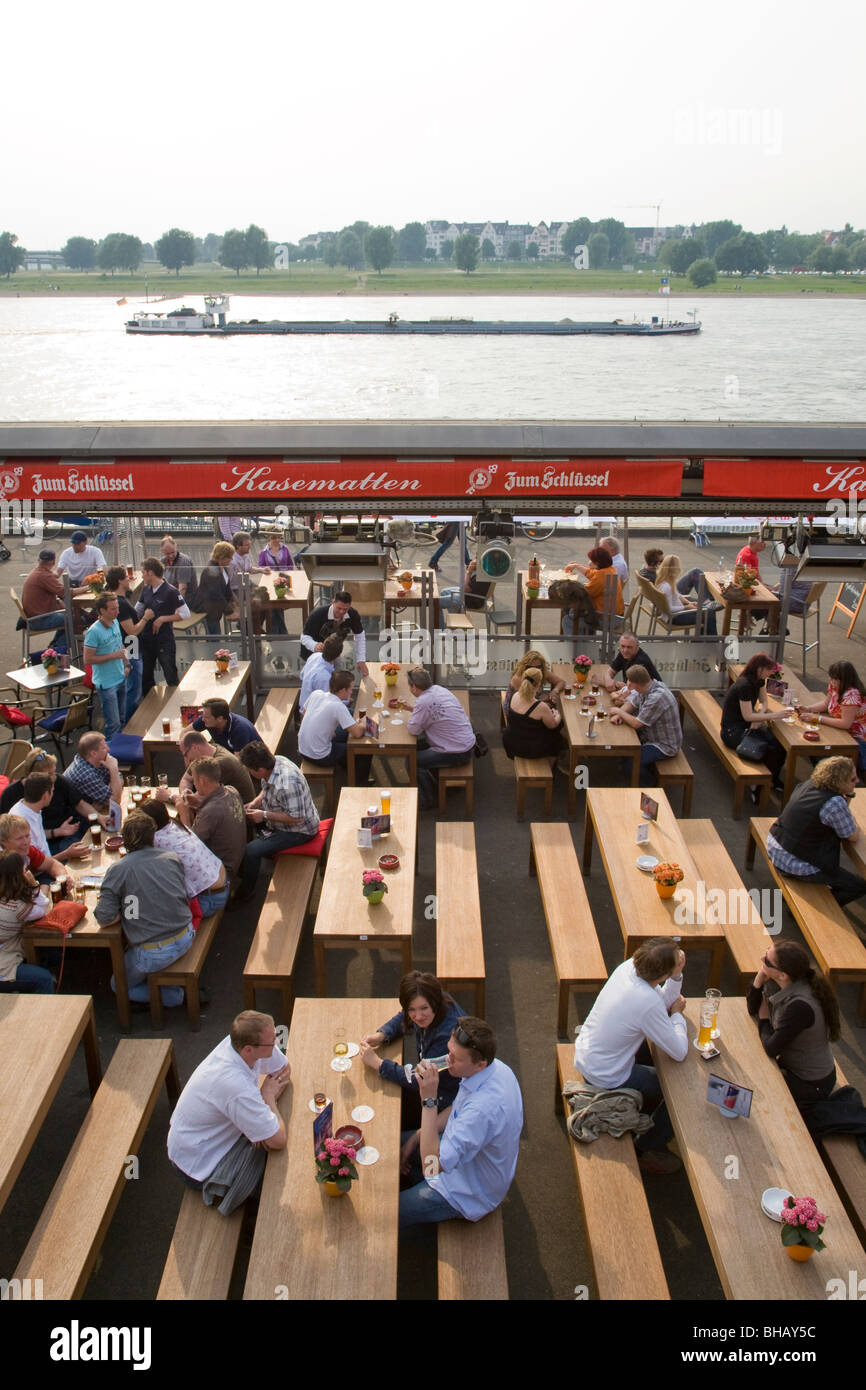 KASEMATTEN BEER TAVERN ALONG RIVER RHINE WATER FRONT IN DUSSELDORF, RHINE RIVER, NORTH RHINE WHESTPHALIA, GERMANY Stock Photo