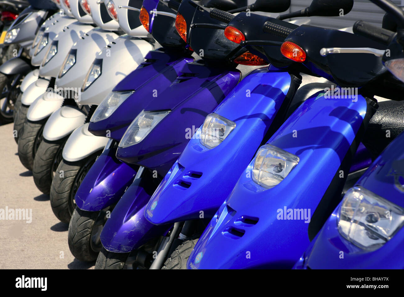 Scooter motorbikes in a row with perspective line Stock Photo Alamy