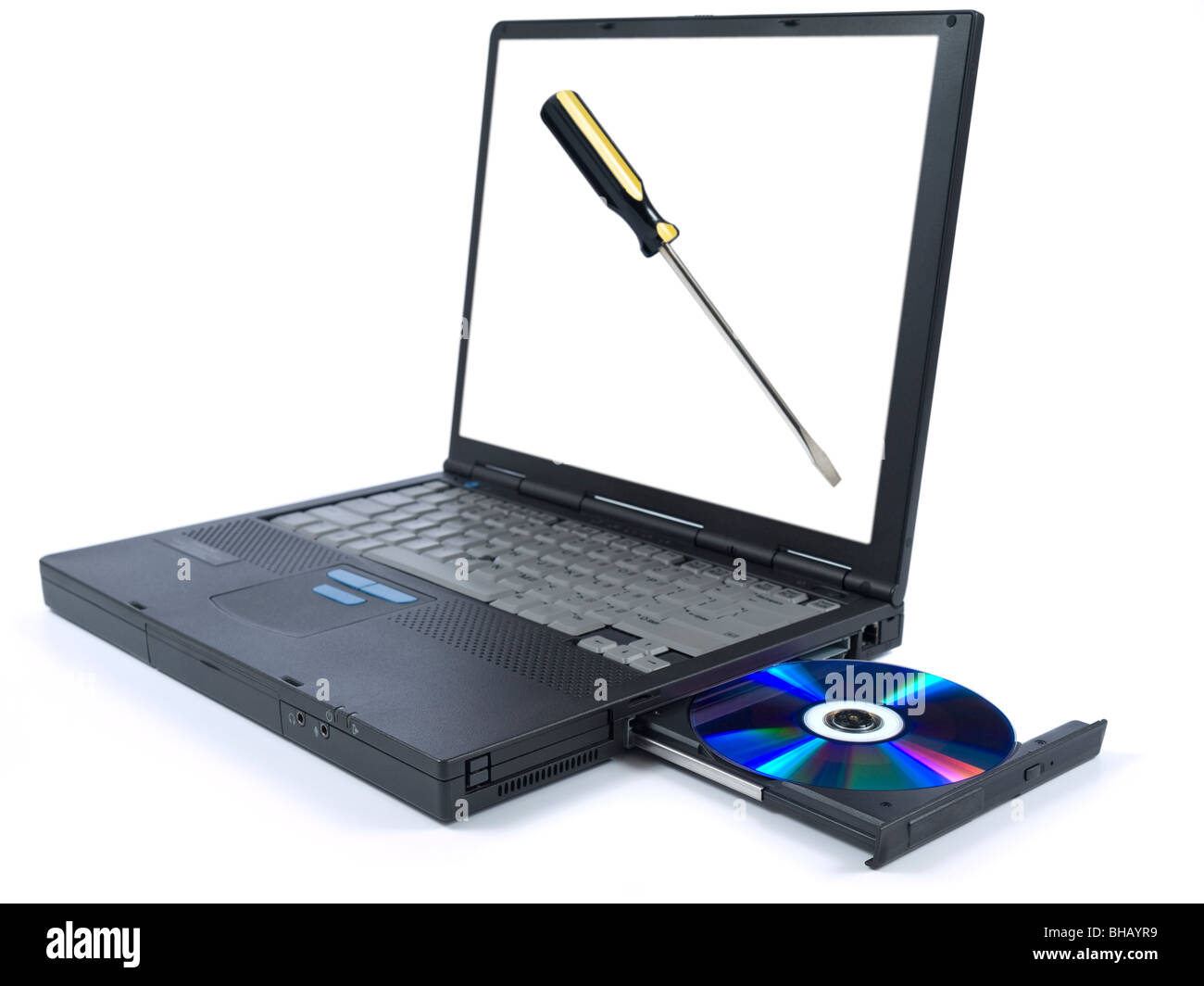 Isolated black laptop with a DVD in tray and an isolated screwdriver on the screen. Stock Photo