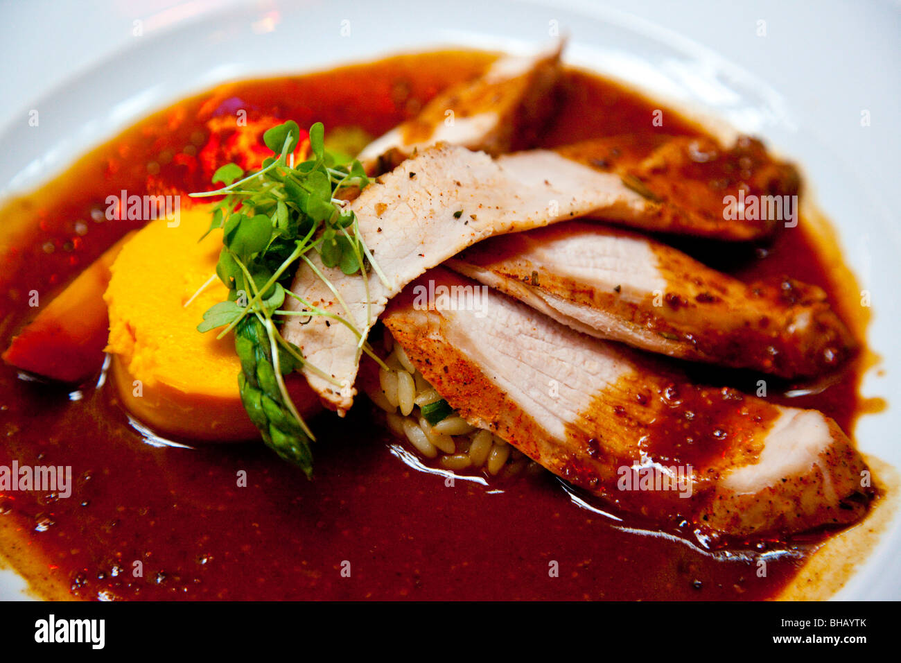 Roast suckling pig at Le Saint Amour in Old Quebec City, Canada Stock Photo