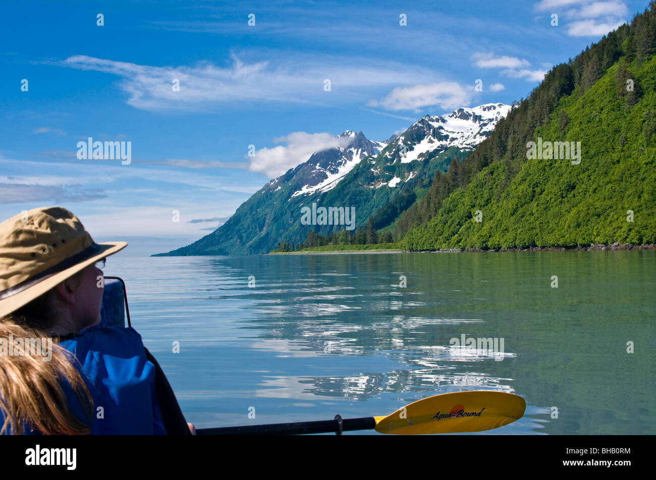 Woman kayaking in Port Valdez, Prince William Sound, Southcentral Alaska, Summer Stock Photo