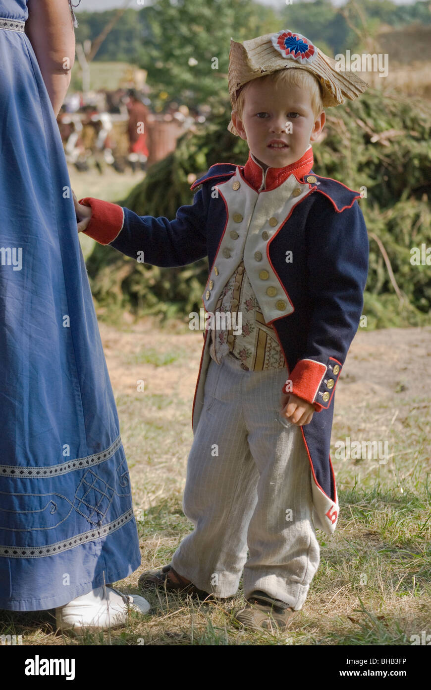 Child holding to mother's dress at Reenactment of Siege of Neisse during 1807 Napoleonic War with Prussia in Nysa, Poland Stock Photo