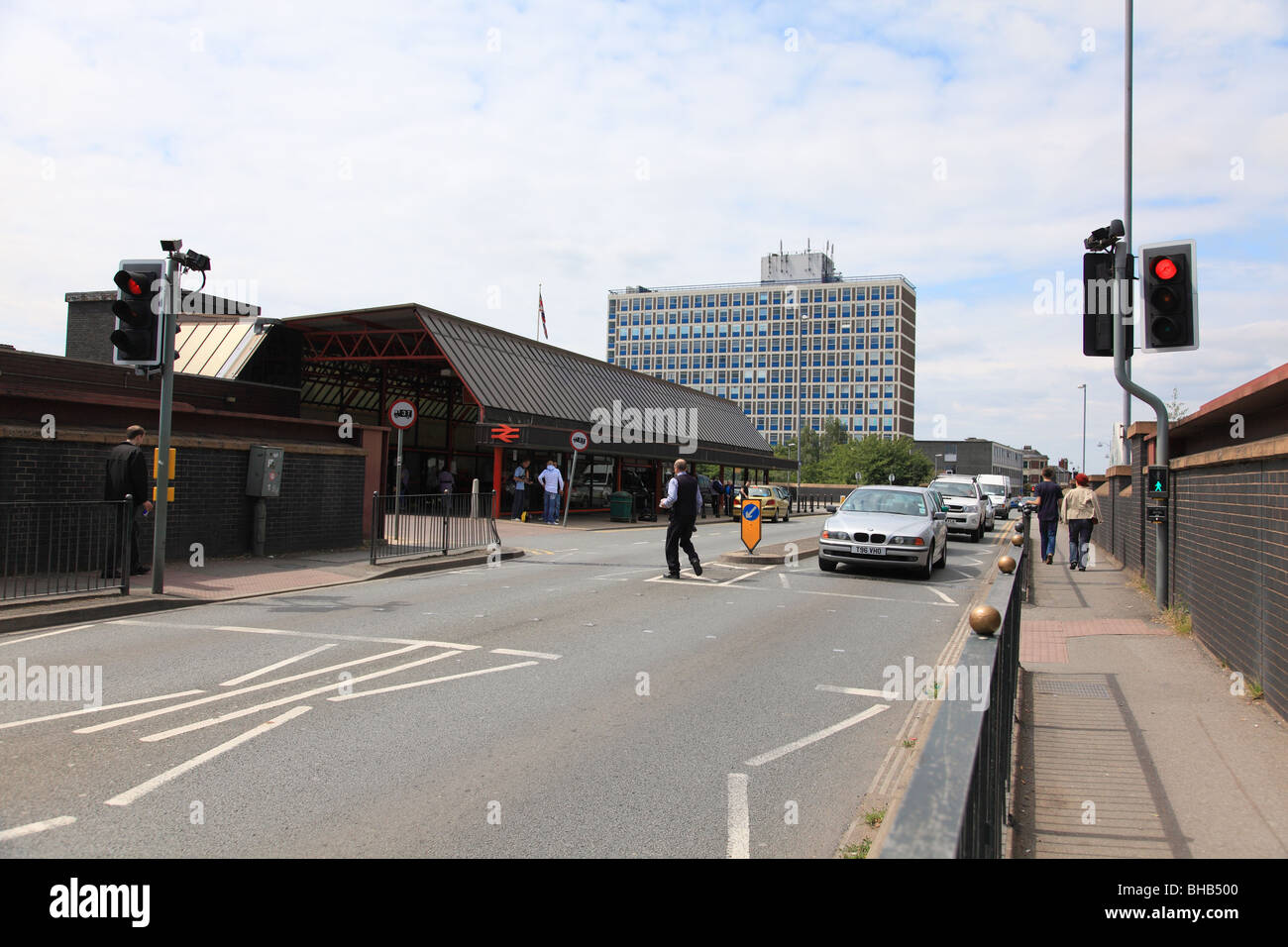 Entrance to Crewe railway station, Rail House in the background and pedestrian crossing in the foreground Stock Photo