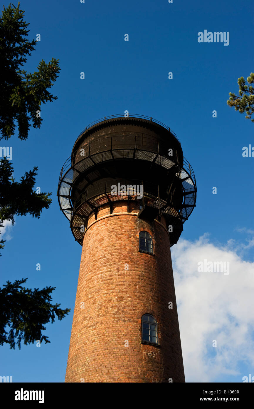 a tall high red brick built building formerly a water tower now a