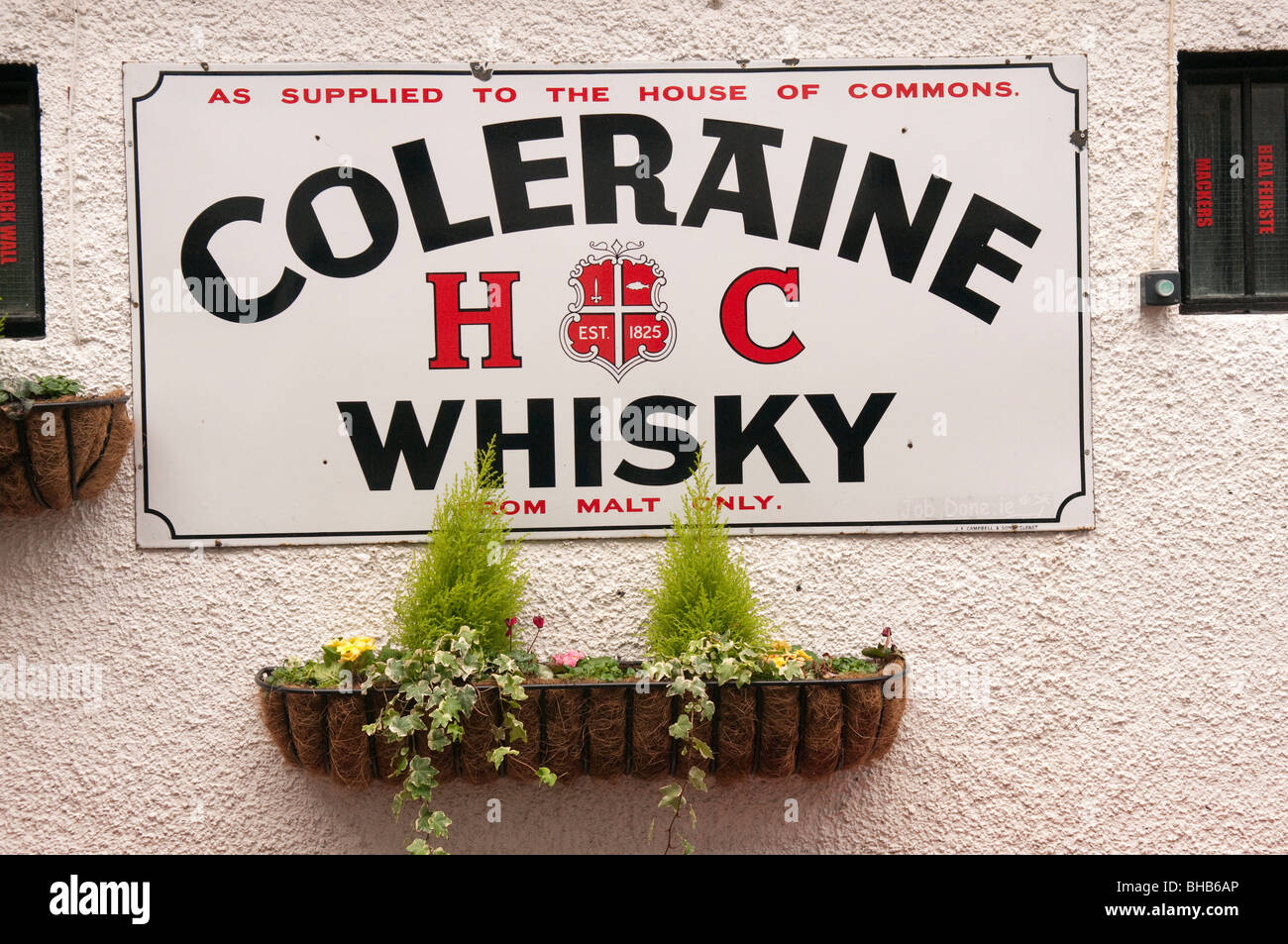 Sign advertising 'Coleraine Whisky' on the wall of the Duke of York pub, Belfast. Stock Photo