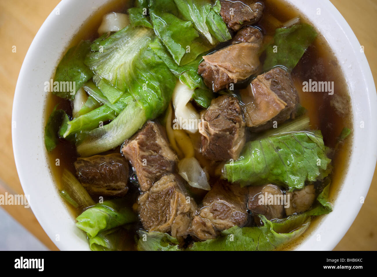 Taiwanese beef and noodle soup, garnished with lettuce and chunks of braised beef, Taipei, Taiwan. Stock Photo